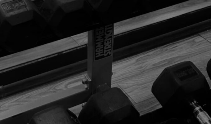 Dumbbells weights on a rack.